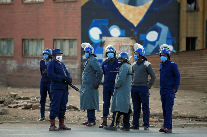 Police patrol the streets ahead of planned anti-government protests in Harare