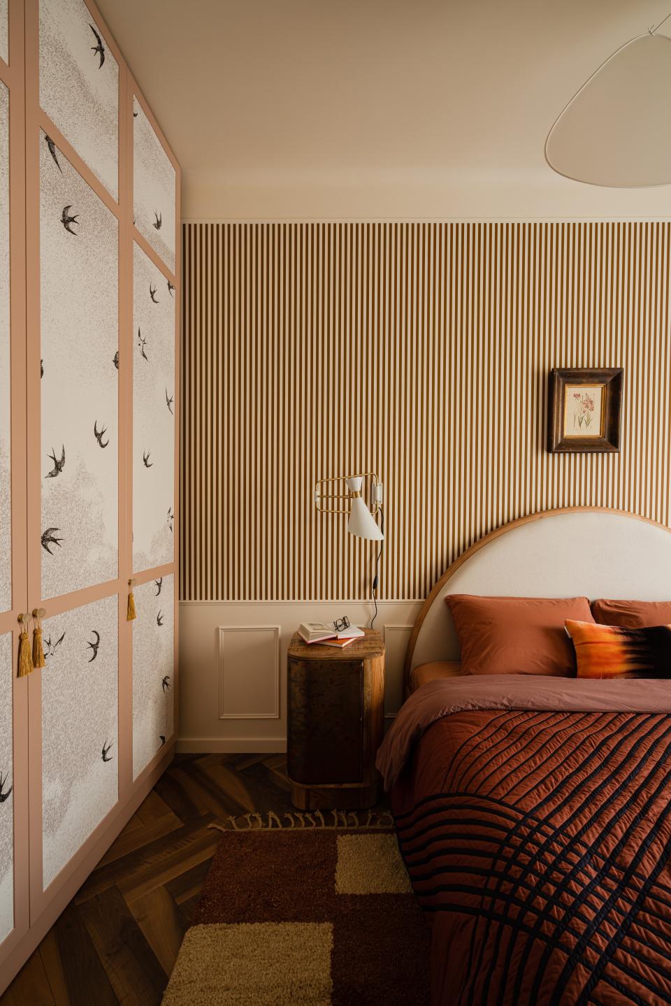 Yana used washable wallpaper to create the bird-motif panels on the custom wardrobe.