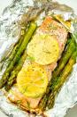 <p>These super-fresh salmon grill packs make clean-up a breeze.</p><p>Get the <a href="https://www.delish.com/uk/cooking/recipes/a29205113/foil-pack-grilled-salmon-with-lemony-asparagus-recipe/" rel="nofollow noopener" target="_blank" data-ylk="slk:Foil Pack Grilled Salmon with Lemony Asparagus;elm:context_link;itc:0;sec:content-canvas" class="link ">Foil Pack Grilled Salmon with Lemony Asparagus </a>recipe. </p>