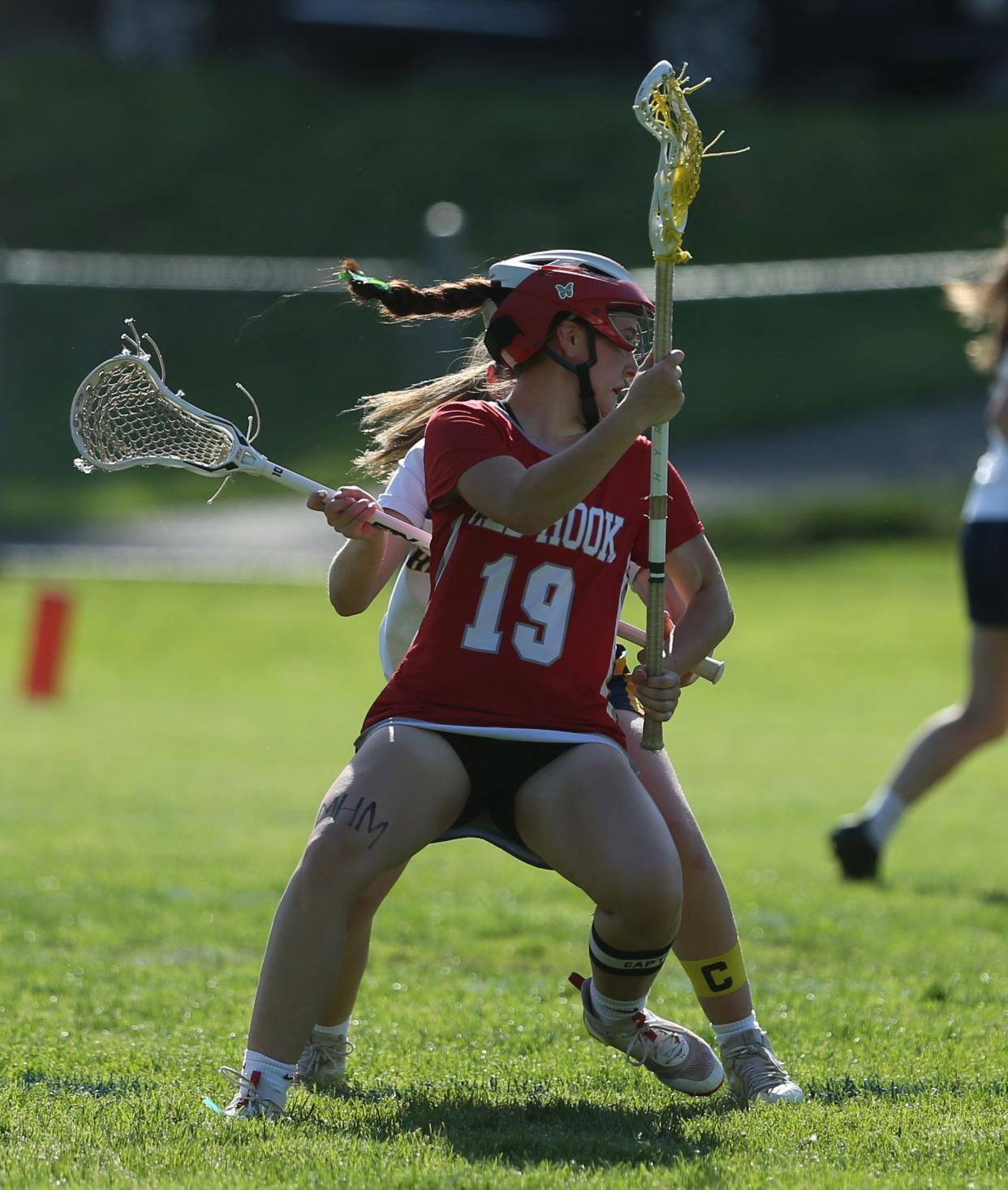 Red Hook's Yianna Giannoulis pivots against a Highland defender during a May 8, 2024 girls lacrosse game.