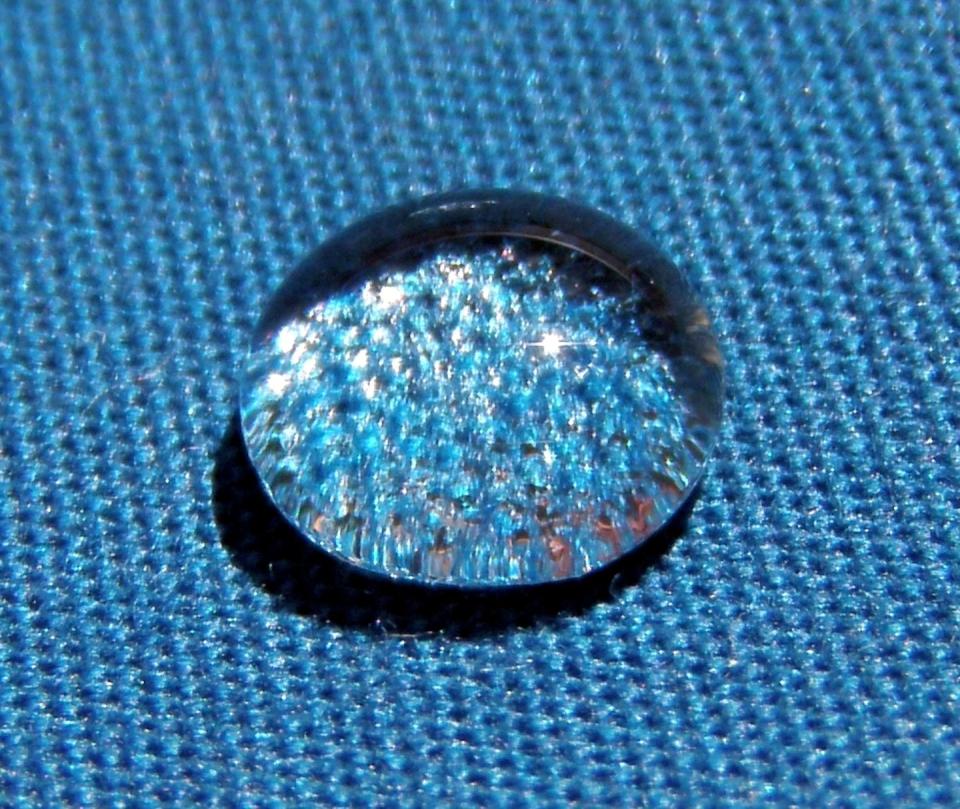 Chemicals used to create water-repellent fabrics and nonstick pans often contain PFAS and leak those chemicals into the environment. <a href="https://commons.wikimedia.org/wiki/File:A_water_droplet_DWR-coated_surface2_edit1.jpg#/media/File:A_water_droplet_DWR-coated_surface2_edit1.jpg" rel="nofollow noopener" target="_blank" data-ylk="slk:Brocken Inaglory/Wikimedia Commons;elm:context_link;itc:0;sec:content-canvas" class="link ">Brocken Inaglory/Wikimedia Commons</a>, <a href="http://creativecommons.org/licenses/by-sa/4.0/" rel="nofollow noopener" target="_blank" data-ylk="slk:CC BY-SA;elm:context_link;itc:0;sec:content-canvas" class="link ">CC BY-SA</a>