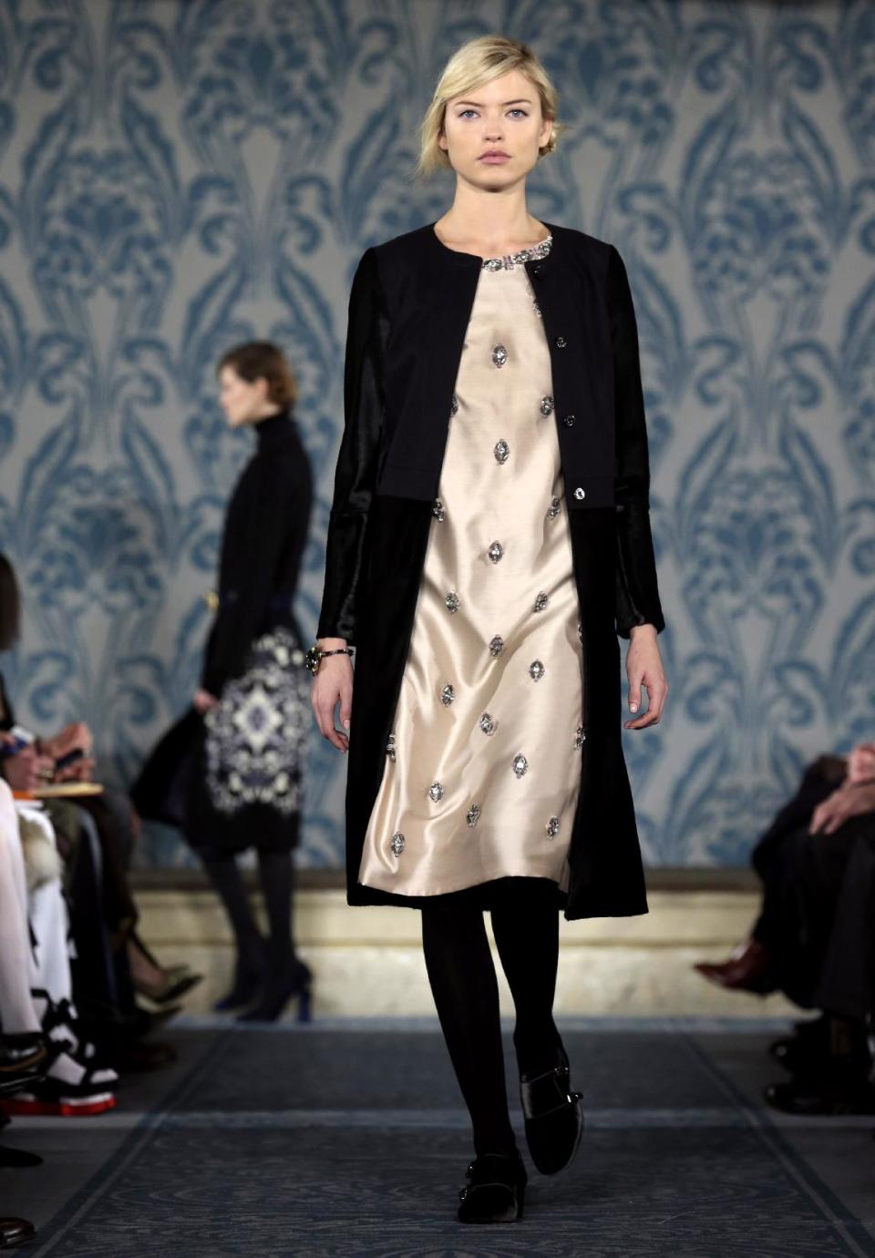 The Tory Burch Fall 2013 collection is modeled during Fashion Week in New York on Tuesday, Feb. 12, 2013. (AP Photo/Richard Drew)