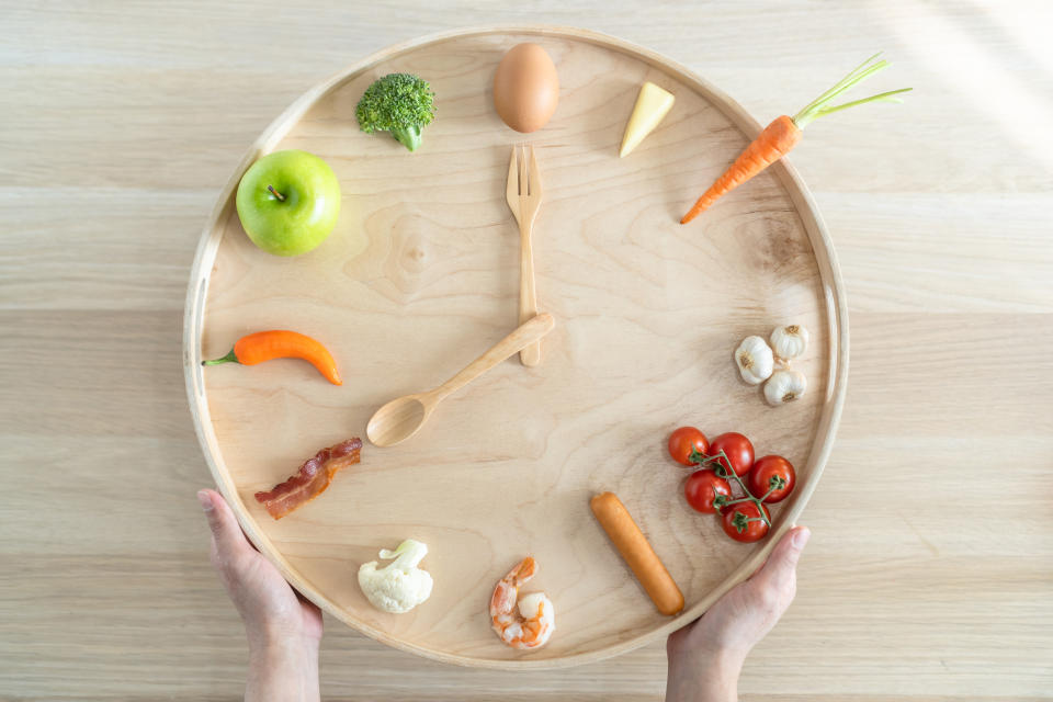 Intermittent fasting diet concept with 8-hour clock