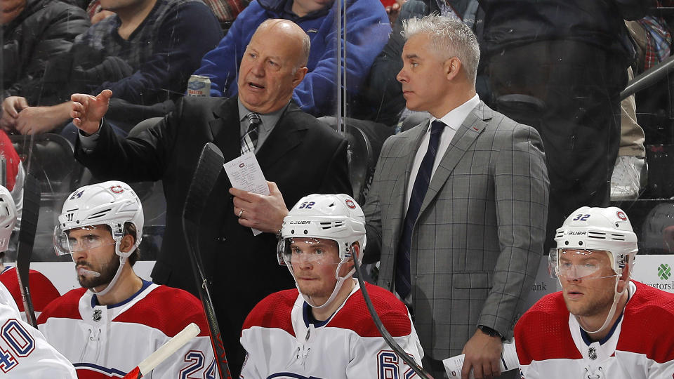 Claude Julien serves up an opinion to his eventual replacement. (Photo by Adam Hunger/NHLI via Getty Images)