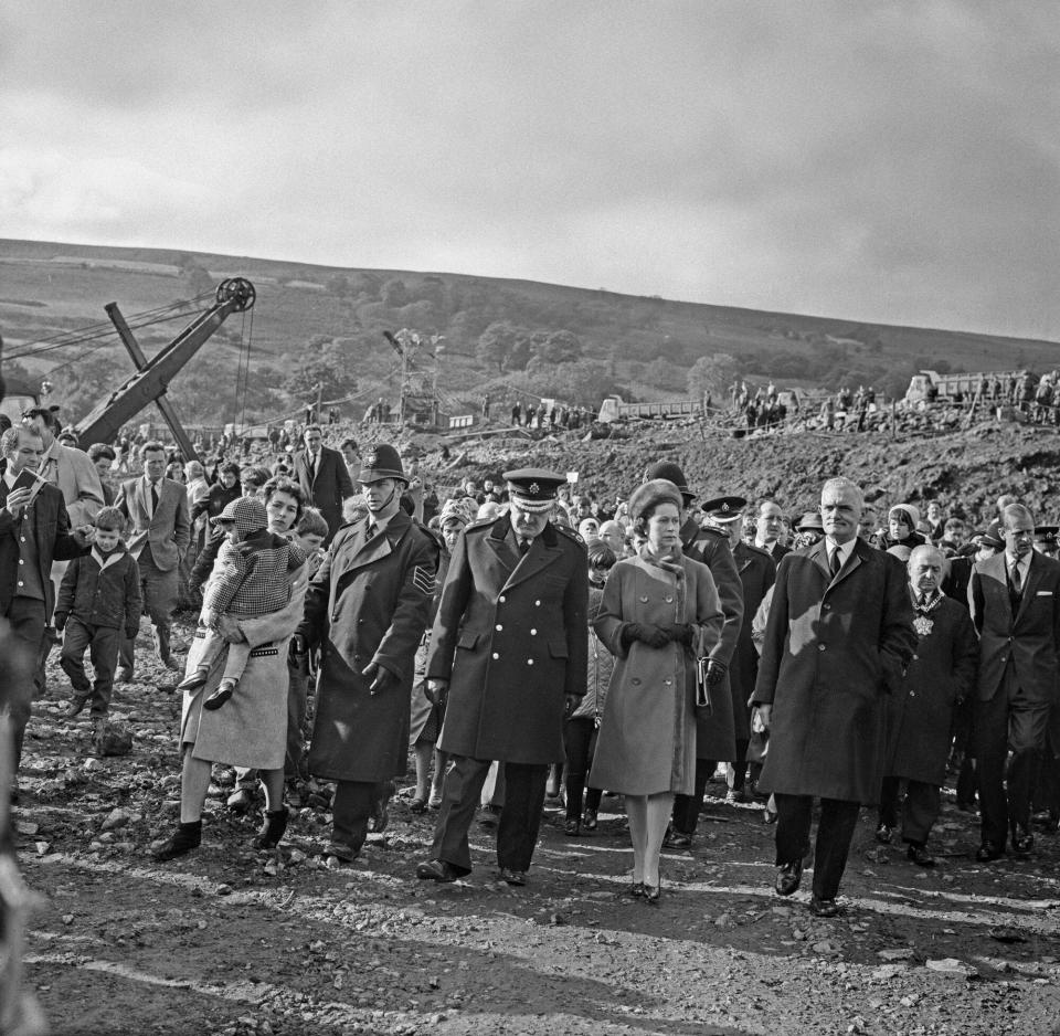 Queen Elizabeth II visits the coal mining village of Aberfan in Wales, following the disaster which resulted in the deaths of 116 children and 28 adults, UK, 29th October 1966.