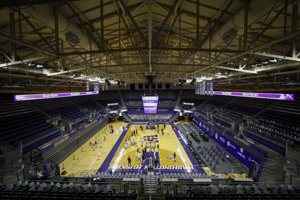 Players warm up for an NCAA college basketball game between Colorado and Washington on Wednesday, Jan. 20, 2021, in Seattle. (AP Photo/Joe Nicholson)