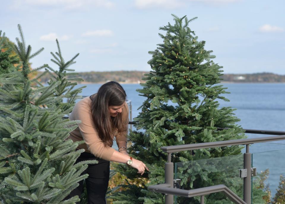 Megan Yaps, catering planning manager at Wequassett Resort and Golf Club in Harwich, prepares a tree for display. To celebrate the first year of being open for the winter holidays, the resort is recreating the feeling of the North Pole for overnight guests and those who live on Cape Cod.