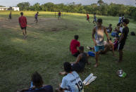 Locals play soccer on an old baseball field in the Santa Fe municipality of Guanabacoa east of Havana, Cuba, Saturday, Oct. 15, 2022. The island's situation has prompted well-known Cuban soccer players to defect during regional tournaments, with several joining teams in the U.S. in the past two decades as talent drains from an island that FIFA currently ranks 167 out of 211 countries. (AP Photo/Ramon Espinosa)