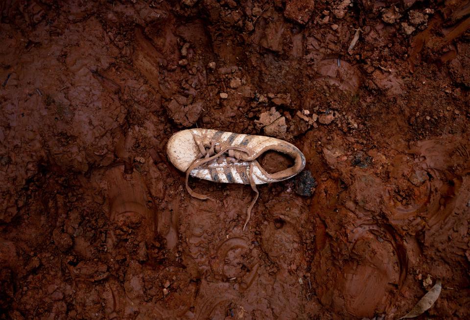 An abandoned shoe is stuck in the mud on the trail through the Darién Gap. | Spenser Heaps, Deseret News