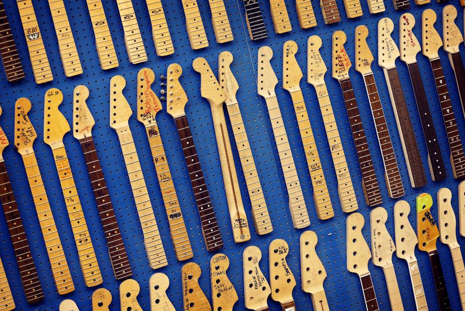 This Tuesday, Oct. 15, 2013 photo shows Fender Stratocaster electric guitar neck templates at the Fender factory in Corona, Calif. Celebrating 60 years in 2014, countless musicians continue to use the instrument to make all genres of music globally. (AP Photo/Matt York)