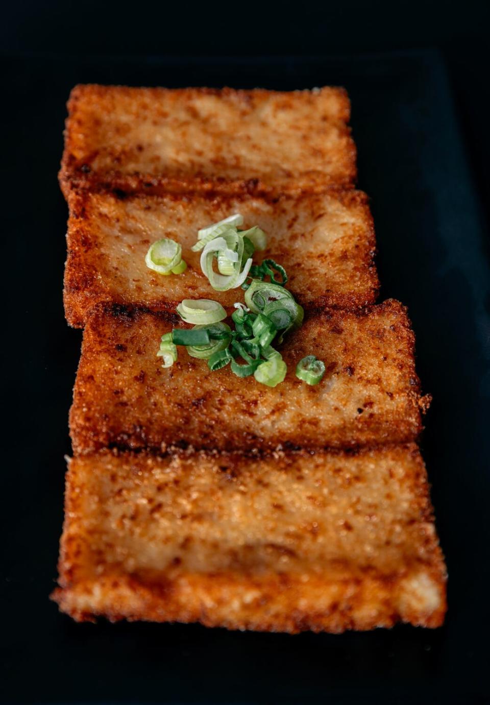 Lo bak go (daikon cakes) are crispy on all sides at restaurant Yi Mei.