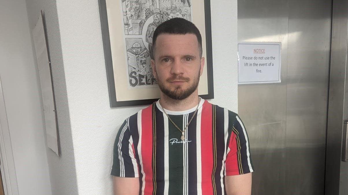 Matt Windle, former boxing champion, standing in a hallway