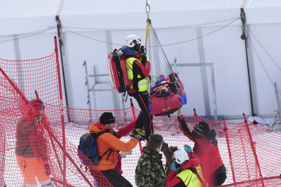 Norway's Adrian Smiseth Sejersted is airlifted on a helicopter after crashing during during the first run of an alpine ski, men's World Cup combined in Wengen, Switzerland, Friday, Jan. 17, 2020. (AP Photo/Marco Tacca)