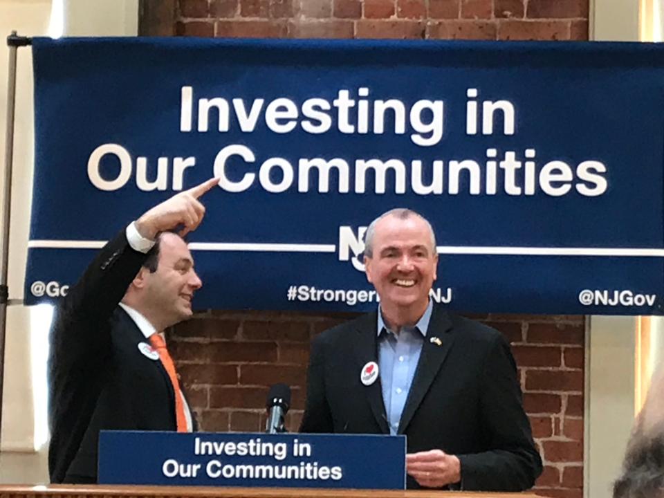 New Jersey Gov. Phil Murphy and Paterson Mayor Andre Sayegh (left) talk ahead of a press conference in Paterson, where Murphy unveiled a new historic preservation tax credit program, on Fri., Feb. 25, 2019.