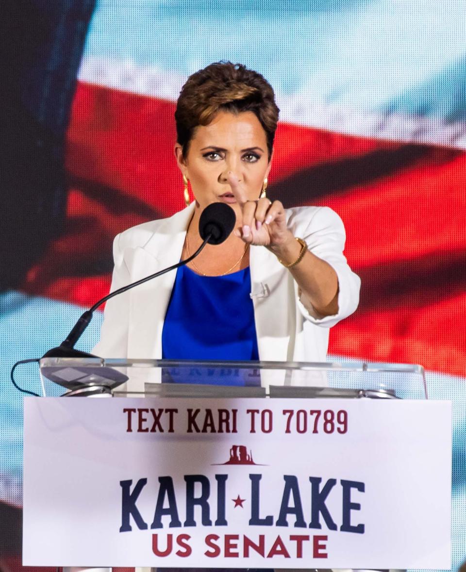 Oct 10, 2023; Scottsdale, AZ, United States; Kari Lake points to members of the media during an announcement rally at Jetset Magazine in Scottsdale on Oct. 10, 2023.