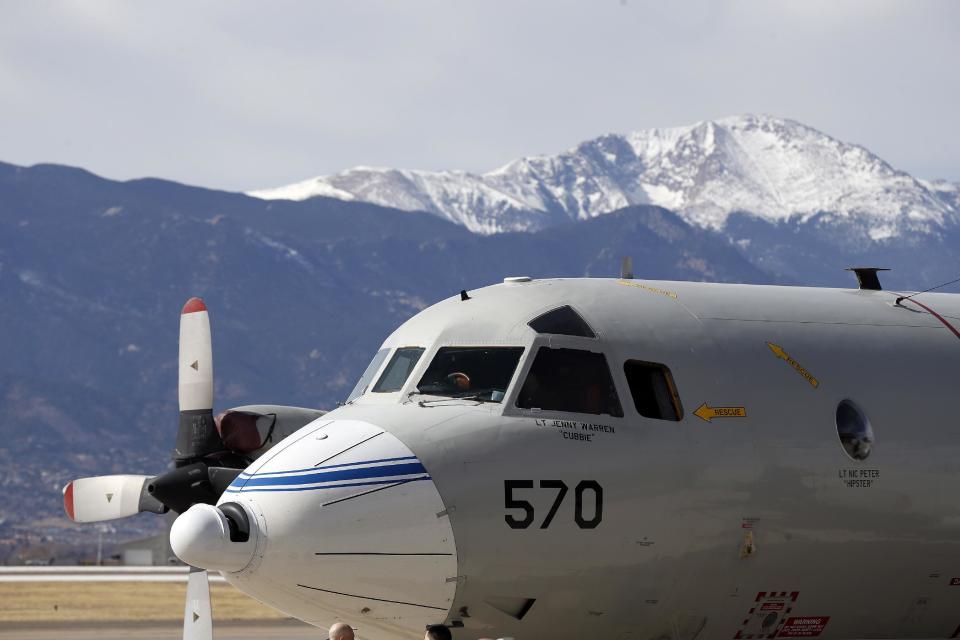 This Feb. 17, 2017, photo shows a Navy P-3 Orion aircraft used for a NASA-led experiment called SnowEx, on an airfield at Peterson Air Force Base in Colorado Springs, Colo. Instrument-laden aircraft are surveying the Colorado high country this month as scientists search for better ways to measure how much water is locked up in the world's mountain snows - water that sustains a substantial share of the global population. (AP Photo/Brennan Linsley)