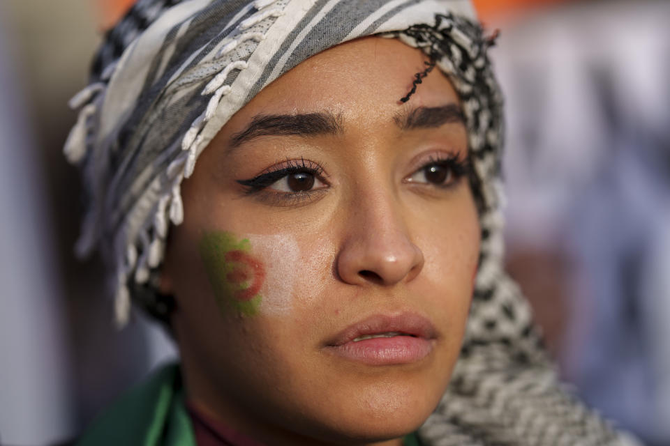 A woman takes part during a protest in support of Palestinians and calling for an immediate ceasefire in Gaza in downtown Madrid, Spain, Saturday, Jan. 27, 2024. (AP Photo/Manu Fernandez)