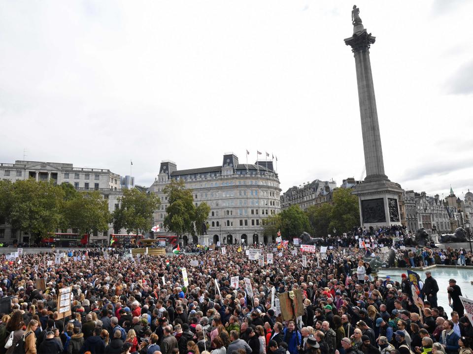 Protesters gather today in Trafalgar Square in London, at a 'We Do Not Consent!' mass rally against vaccination and government restrictions designed to fight the spread of the novel coronavirus (AFP via Getty Images)