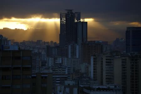 A skyscraper known as the "Tower of David" is seen in Caracas January 31, 2014. It boasts a helicopter landing pad, glorious views of the Avila mountain range, and large balconies for weekend barbecues. REUTERS/Jorge Silva
