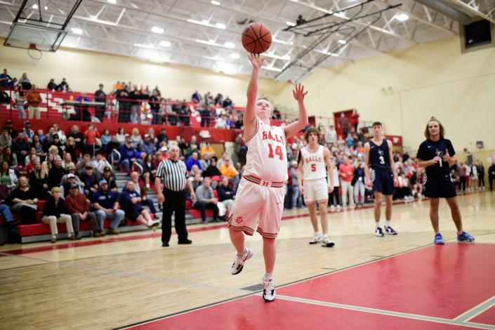 Halls&#39; Maddox Shields (14) shoots a layup during a game against Anderson County at Halls High School in Halls, Tenn. on Friday, Jan. 28, 2022. Shields, who has a learning disability, had the opportunity to play alongside his teammates and score Hall&#39;s first point of the game against Anderson County.
