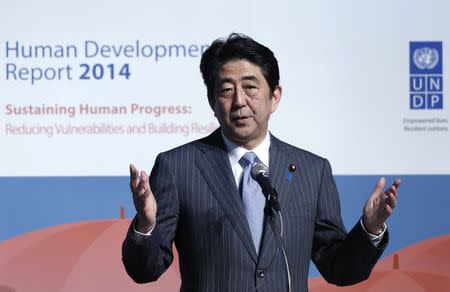 Japan's Prime Minister Shinzo Abe gives a speech during an announcement event of the Global Launch of Human Development Report 2014 at the United Nations University Headquarters in Tokyo July 24, 2014. REUTERS/Yuya Shino