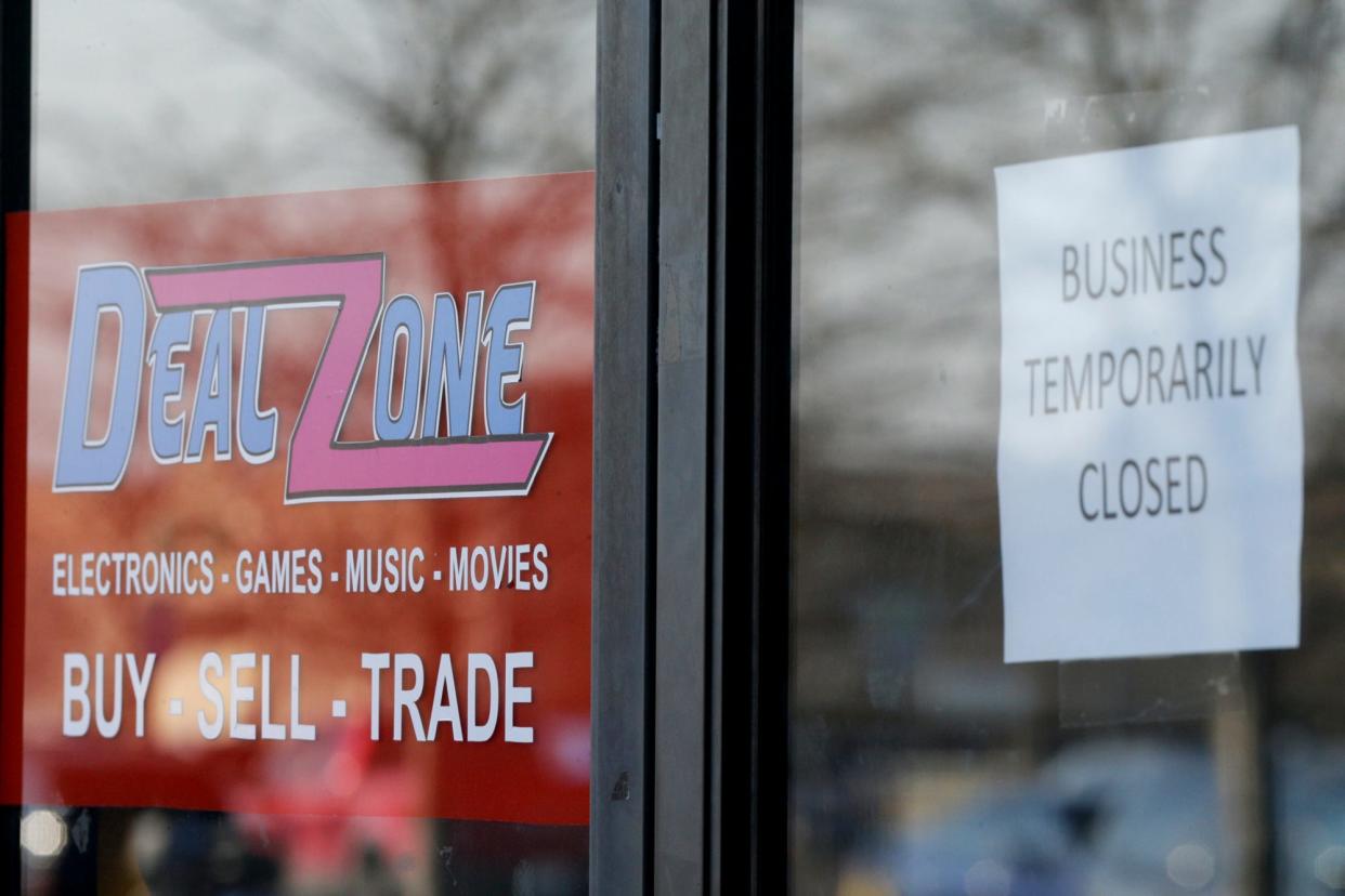 "Business temporarily closed" reads a sign posted on the door of Deal Zone, 100 South Creasy Lane, Monday, March 8, 2021 in Lafayette