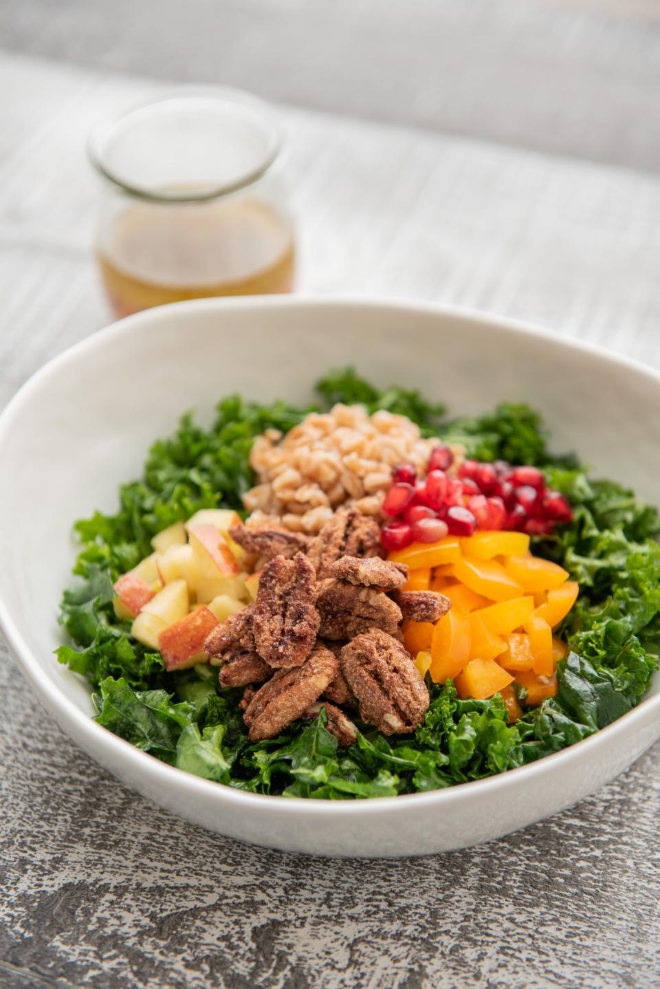 Today's kale salad is served with a dressing made with  ginger, garlic, citrus and a touch of maple syrup.