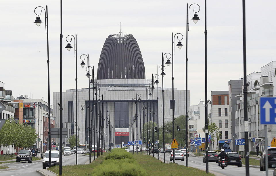 Cars drive on the street in front of the Temple of Divine Providence, a major church in the Polish capital, in Warsaw, Poland, Monday, May 13, 2019. A new documentary about pedophile priests has deeply shaken Poland, one of Europe's most Roman Catholic societies, eliciting an apology from the church hierarchy and prompting one priest to leave the clergy.(AP Photo/Czarek Sokolowski)