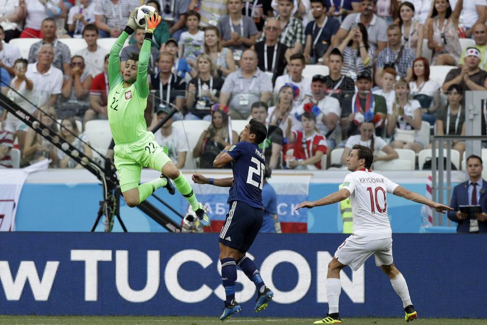 <p>Lukasz Fabianski makes an athletic save against Japan </p>