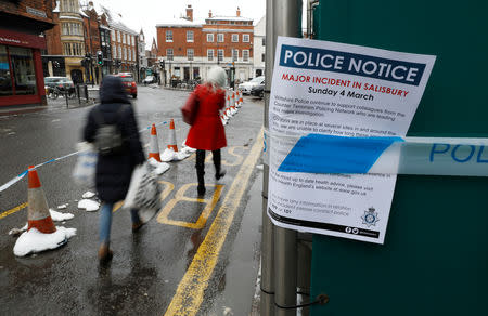 FILE PHOTO: A police notice is attached to screening surrounding a restaurant which was visited by former Russian intelligence officer Sergei Skripal and his daughter Yulia before they were found on a park bench after being poisoned in Salisbury, Britain, March 19, 2018. REUTERS/Peter Nicholls -/File Photo