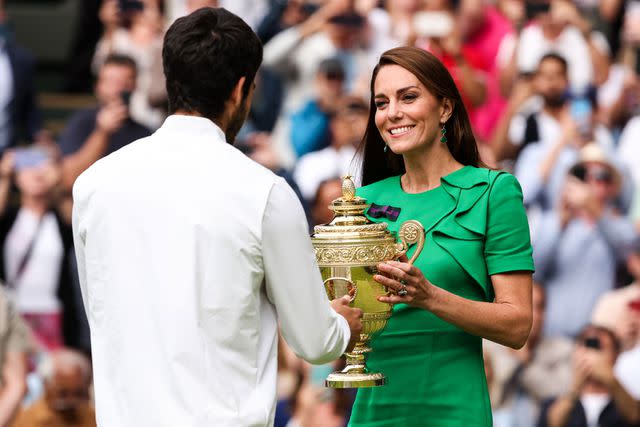 <p>Shi Tang/Getty </p> Kate Middleton gives the trophy to Carlos Alcaraz of Spain at Wimbledon 2023