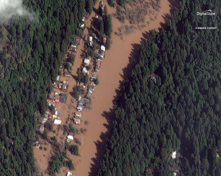 Homes submerged by flood waters of the Russian River are shown in this satellite image near Guerneville, California, U.S., February 28, 2019. Photo taken February 28,2019. Courtesy ©2019 DigitalGlobe, a Maxar company/Handout via REUTERS