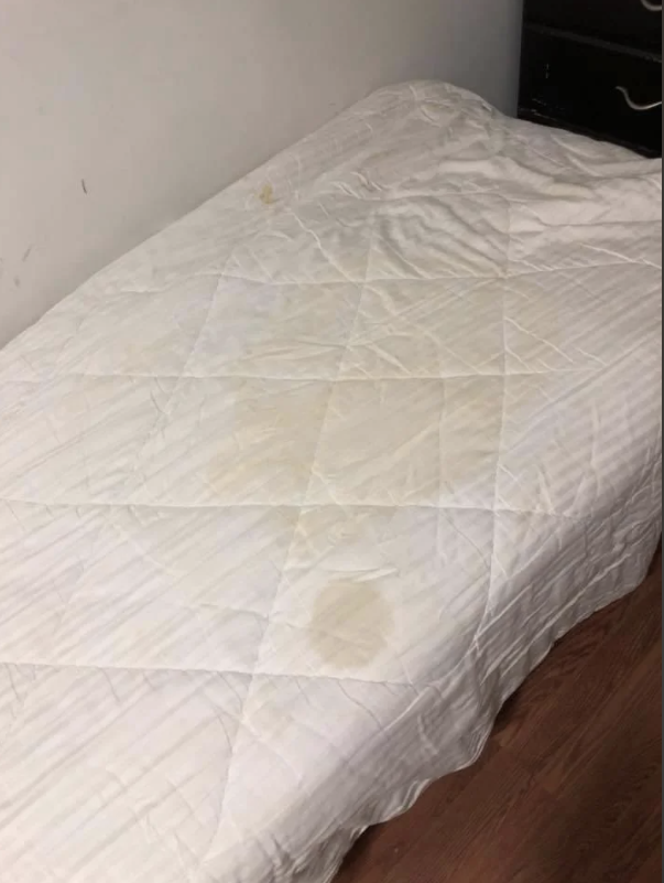 Stained sheets on a mattress