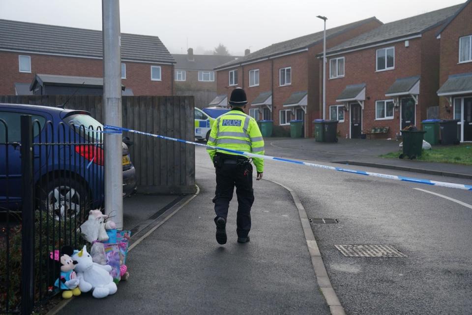 Soft toys and flowers left at the scene in Robin Close, Rowley Regis (Jacob King/PA Wire)