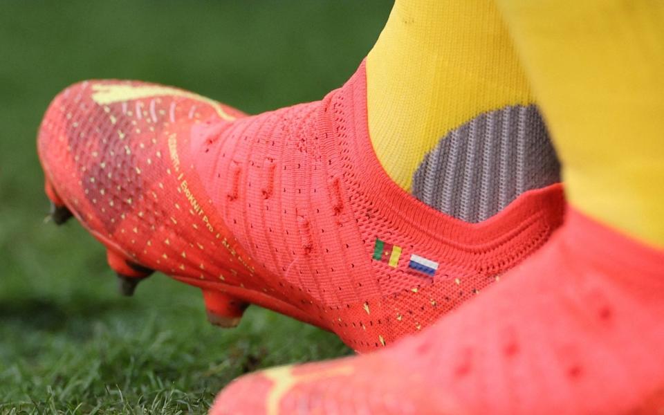 The boots of Gael Ondoua with the Russian flag on them during Cameroon's World Cup match against Serbia - Carl Recine /Reuters