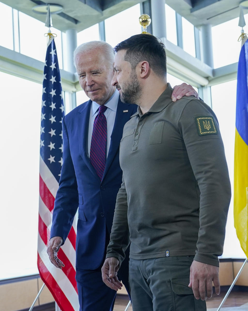 President Joe Biden, left, walks with Ukrainian President Volodymyr Zelenskyy ahead of a working session on Ukraine during the G7 Summit in Hiroshima, Japan, Sunday, May 21, 2023. (AP Photo/Susan Walsh, POOL)