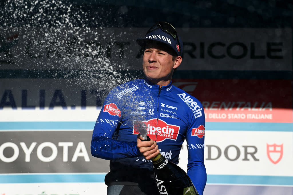  Tirreno-Adriatico: Jasper Philipsen (Alpecin-Deceuninck) sprays the champagne on the podium after winning stage 7 