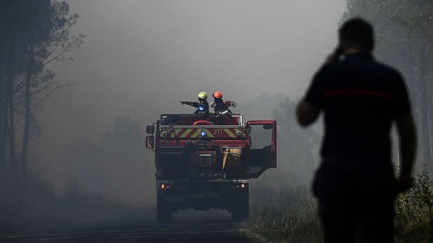 PHOTO: Firefighters stand guard to monitor fire outbreaks and restarts near Saint-Magne in southwestern France on August 10, 2022. (Philippe Lopez/AFP via Getty Images)