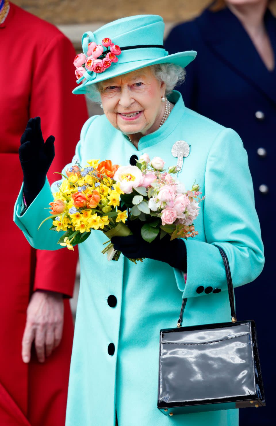 The Queen also uses her handbag to send signals. Photo: Getty