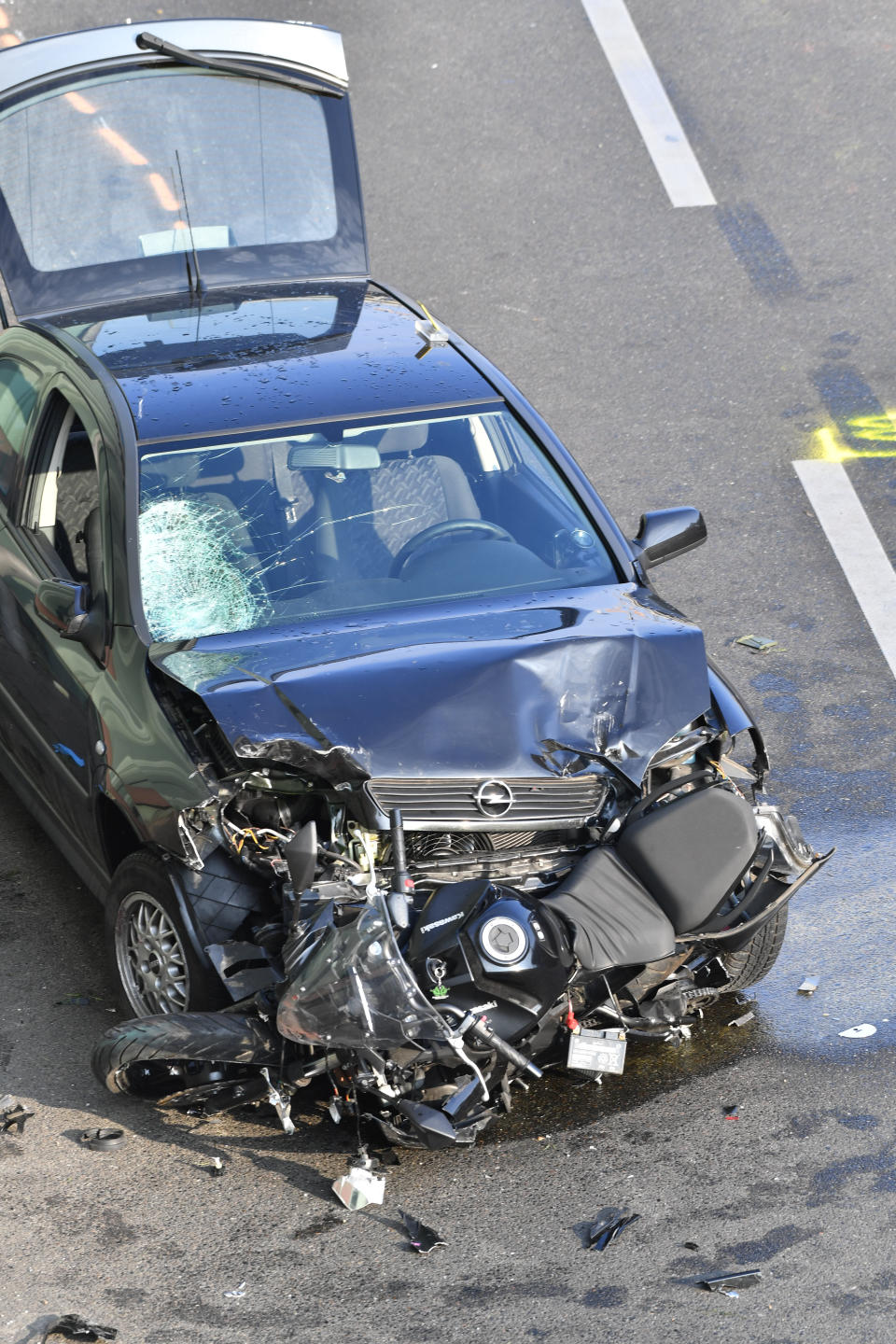 19 August 2020, Berlin: A broken car and a destroyed motorcycle are standing on the Berlin city motorway A100 near the exit Alboinstraße. The State Security is investigating a man who caused the city highway to be closed for hours and who was carrying an alleged ammunition box. According to initial findings, the driver had previously caused several accidents and then announced that the box contained a "dangerous object", a police spokeswoman said during the night. Photo: Paul Zinken/dpa-Zentralbild/dpa (Photo by Paul Zinken/picture alliance via Getty Images)