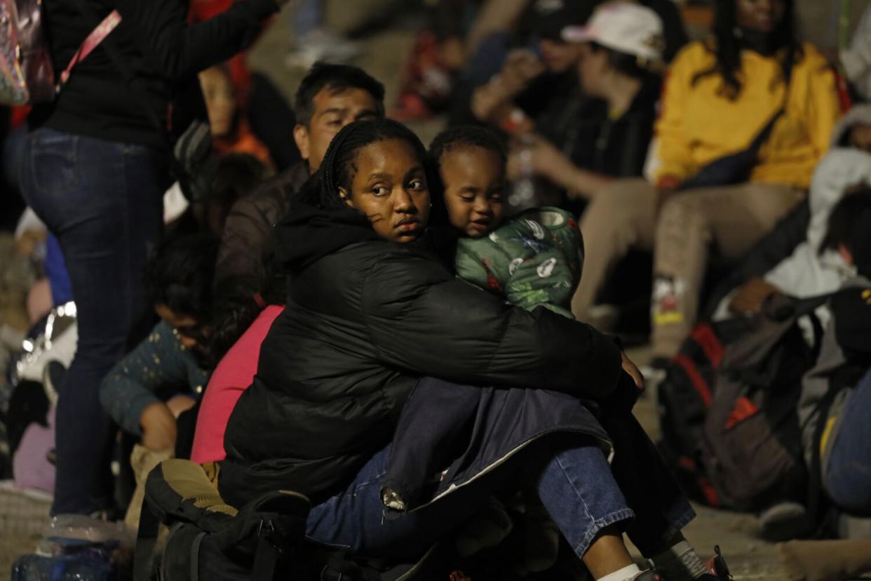 Migrants hoping to cross into the United States from Tijuana wait in an area north of the city.