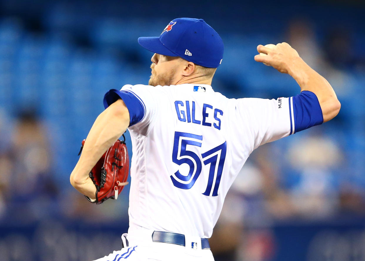 TORONTO, ON - JULY 23:  Ken Giles #51 of the Toronto Blue Jays delivers a pitch in the tenth inning during a MLB game against the Cleveland Indians at Rogers Centre on July 23, 2019 in Toronto, Canada.  (Photo by Vaughn Ridley/Getty Images)