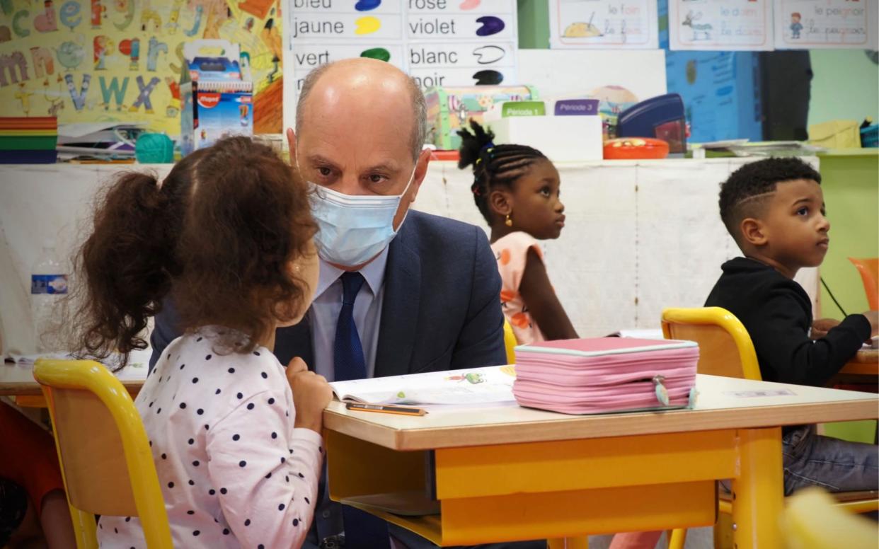 French education minister Jean-Michel Blanquer talks to child at Louis de Frontenac elementary school, Chateauroux, central France - GUILLAUME SOUVANT/POOL/EPA-EFE/Shutterstock