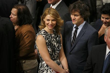 U.S. actress Claire Danes (C) and her husband, British actor Hugh Dancy (centre R) are seen among the audience during the Nobel Peace Prize awards ceremony at the City Hall in Oslo December 10, 2013. REUTERS/Heiko Junge