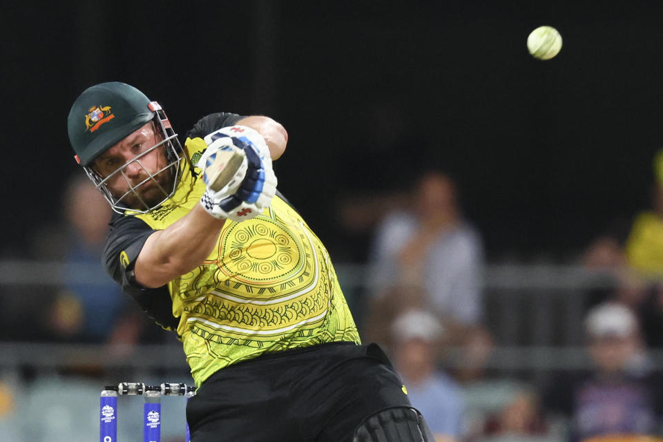 FILE - Australia's Aaron Finch hits a boundary during the T20 World Cup cricket match between Australia and Ireland, in Brisbane Australia, Monday, Oct. 31, 2022.Finch, Australia's men's T20 cricket captain, announced his retirement from all international cricket Tuesday, Feb. 7, 2023. (AP Photo/Tertius Pickard,File)