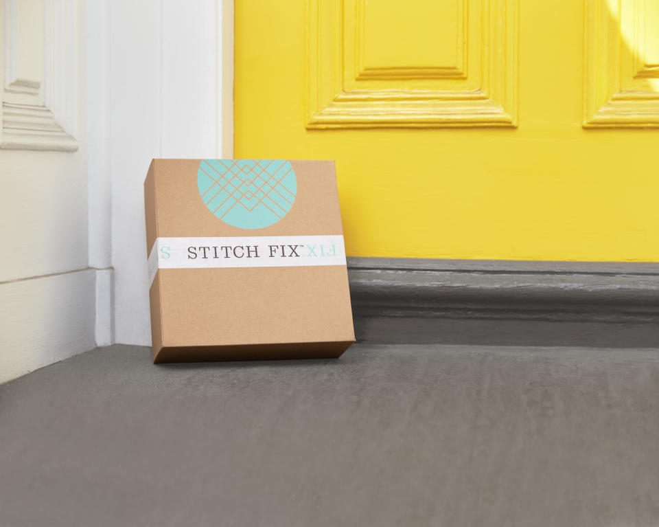 A Stitch Fix box leaning against a doorstep.