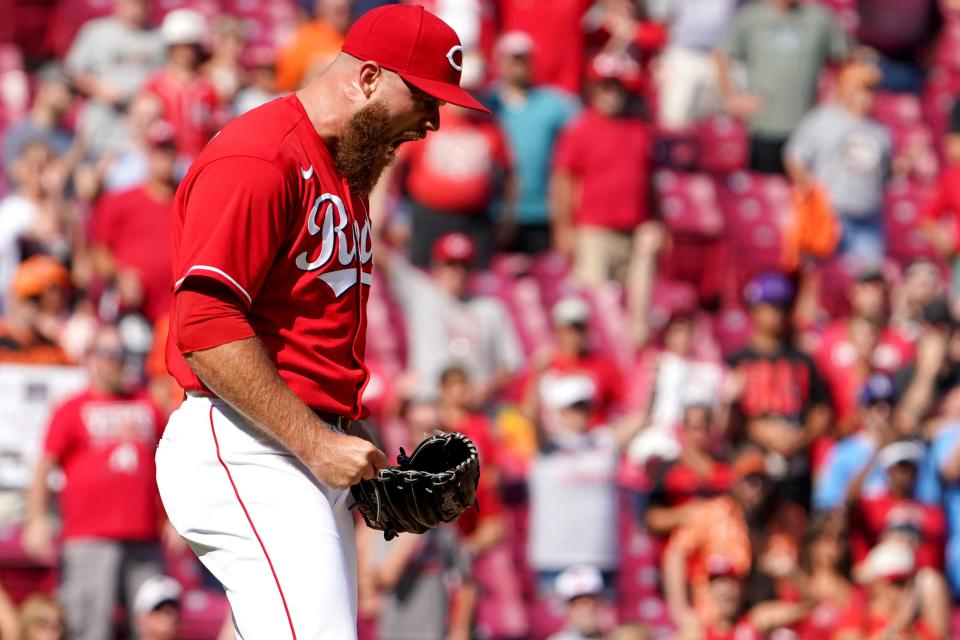 Cincinnati Reds relief pitcher Buck Farmer (46) reacts after recording his first career save at the conclusion of a baseball game against the Baltimore Orioles, Sunday, July 31, 2022, Great American Ball Park in Cincinnati.