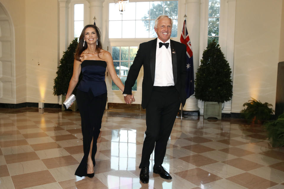 FILE - Golfer Greg Norman, right, and wife Kirsten Kutner arrive for a State Dinner with Australian Prime Minister Scott Morrison and President Donald Trump at the White House, Friday, Sept. 20, 2019, in Washington. Norman and his wife are being sued by a high school girl who says she was sexually assaulted at their Florida home in Sept. 2021, by two boys during a party where alcohol was served to her, her alleged attackers and other minors. (AP Photo/Patrick Semansky, File)