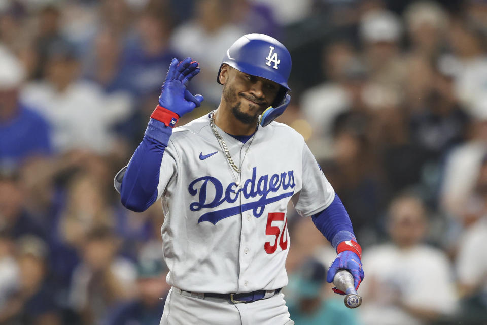 Los Angeles Dodgers' Mookie Betts reacts after striking out during the third inning of a baseball game against the Seattle Mariners, Saturday, Sept. 16, 2023, in Seattle. (AP Photo/Maddy Grassy)