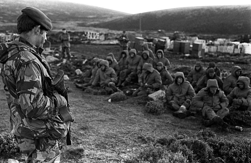 Four decades ago, the UK was equipped with far more resources. Argentinian soldiers captured during the Falklands war at Goose Green are seen being guarded by a British Royal Marine (PA)